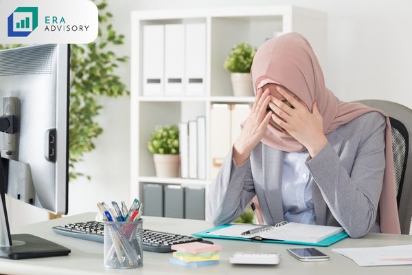 Is it Mandatory to have Wasiat - Muslim woman covering her face seated at her desk