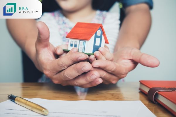 Why Should I Have My Estate Planning Done Today - Hands of father and daughter holding a small house